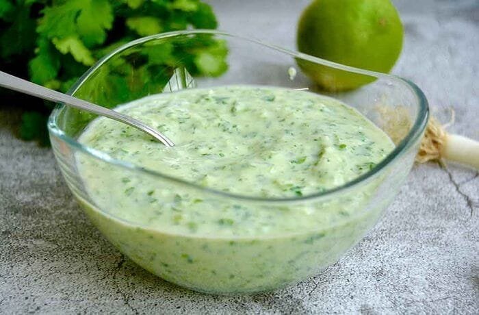 Homemade cilantro yogurt sauce in a bowl