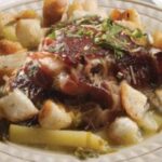 Chilean chalaco clingfish soup with potatoes, fried bread cubes, and fresh cilantro