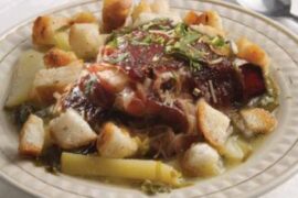 Chilean chalaco clingfish soup with potatoes, fried bread cubes, and fresh cilantro