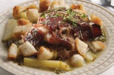 Chilean chalaco clingfish soup with potatoes, fried bread cubes, and fresh cilantro