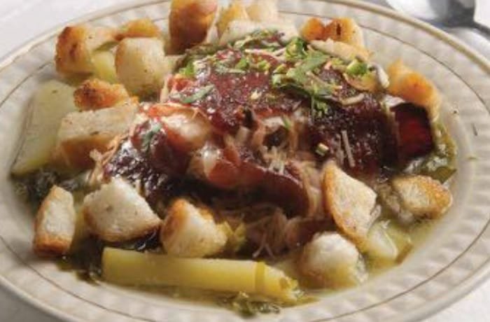 Chilean chalaco clingfish soup with potatoes, fried bread cubes, and fresh cilantro