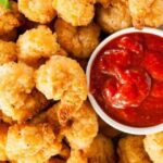 Crispy golden breaded shrimp served as an appetizer