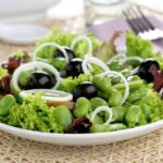 Chilean fava bean salad with lettuce, onion, and olives