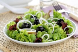Chilean fava bean salad with lettuce, onion, and olives