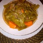Chilean green bean and potato stew with egg served in a deep bowl