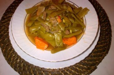 Chilean green bean and potato stew with egg served in a deep bowl