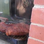 Chilean grilled beef brisket sliced with a dark crust, tapapecho a la parrilla cooked over indirect heat