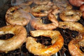 Golden, crispy Chilean grilled chunchules, a classic of the Chilean barbecue