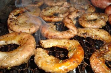 Golden, crispy Chilean grilled chunchules, a classic of the Chilean barbecue
