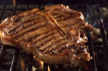 Chilean grilled entrecôte steak with grill marks, resting on a board