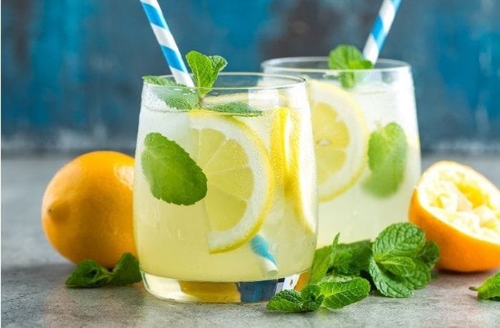 Chilean homemade lemonade with ice and pica lemon slices