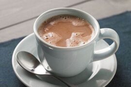 Cups of homemade Chilean hot chocolate made with milk, cocoa, and milk chocolate