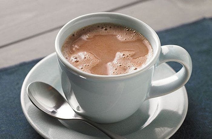 Cups of homemade Chilean hot chocolate made with milk, cocoa, and milk chocolate