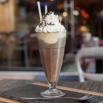 Chilean café helado, iced coffee with vanilla ice cream, whipped cream, and wafer rolls