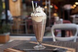 Chilean café helado, iced coffee with vanilla ice cream, whipped cream, and wafer rolls