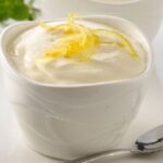 Chilean lemon foam served in individual dessert cups with lemon zest and fresh mint