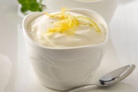 Chilean lemon foam served in individual dessert cups with lemon zest and fresh mint