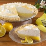 Chilean lemon pie with a shortcrust base, condensed milk lemon filling, and a golden meringue lattice