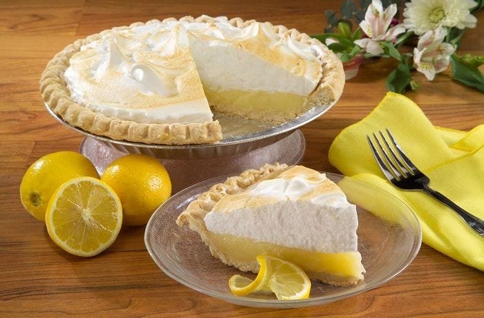 Chilean lemon pie with a shortcrust base, condensed milk lemon filling, and a golden meringue lattice