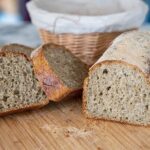 Homemade lentil bread loaf with a scored crust, made without wheat flour or eggs