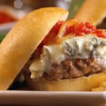 Chilean meatball sandwich in a marraqueta with tomato sauce