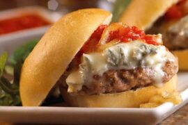 Chilean meatball sandwich in a marraqueta with tomato sauce