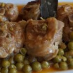 Oven baked turkey osso buco with peas, potatoes, and carrots