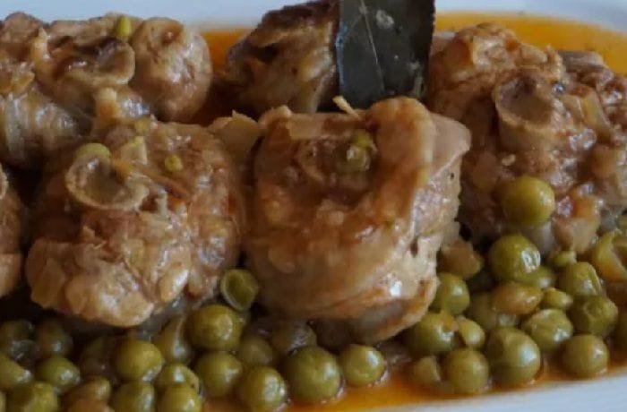 Oven baked turkey osso buco with peas, potatoes, and carrots