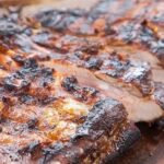 Chilean oven braised short ribs, asado de tira al horno, with red wine and onion sauce