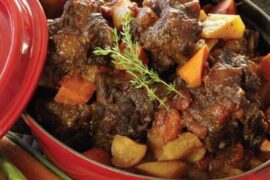 Chilean oxtail braised in red wine with potatoes and carrots in a dark sauce