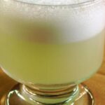 Chilean pisco sour served in a glass with foam, classic homemade pisco sour recipe