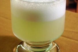 Chilean pisco sour served in a glass with foam, classic homemade pisco sour recipe
