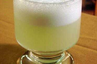 Chilean pisco sour served in a glass with foam, classic homemade pisco sour recipe