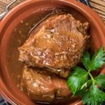 Chilean pot roast, carne a la olla, sliced and served with its vegetable sauce