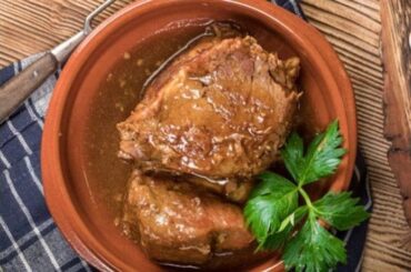 Chilean pot roast, carne a la olla, sliced and served with its vegetable sauce