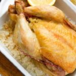 Whole chicken roasted on a bed of coarse salt
