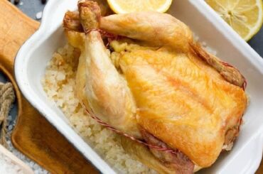Whole chicken roasted on a bed of coarse salt
