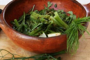 Chilean shallot pebre, a fresh relish of shallots, herbs, vinegar, and merkén in a clay bowl