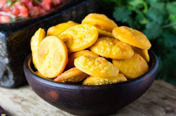 Fried Chilean sopaipillas used as the bread for the pernil sandwich
