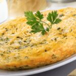Chilean spaghetti omelette, tortilla de fideos, golden and cut into wedges
