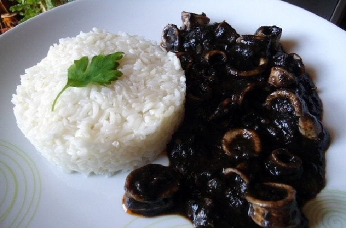 Squid in its own black ink sauce with rice