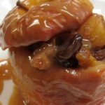 Chilean stuffed baked apples with walnuts, raisins, and cinnamon