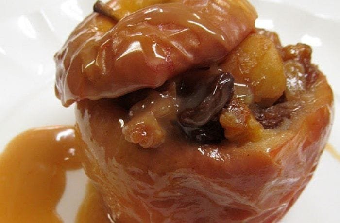 Chilean stuffed baked apples with walnuts, raisins, and cinnamon