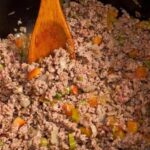 Chilean style ground beef with tomato and chili in a skillet