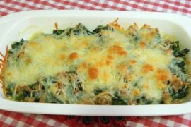 Chilean Swiss chard rolls baked in white sauce with golden parmesan