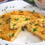 Chilean tuna omelette, tortilla de atún, golden and cut into wedges