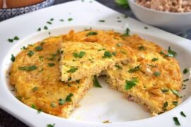 Chilean tuna omelette, tortilla de atún, golden and cut into wedges