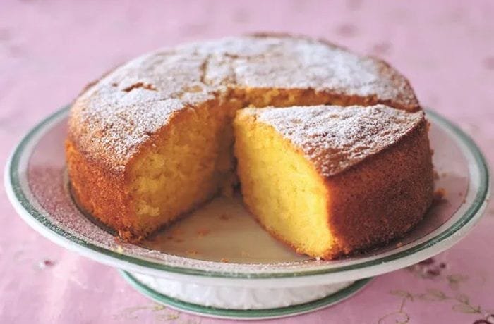 Chilean vanilla loaf cake, queque de vainilla, sliced and dusted with powdered sugar