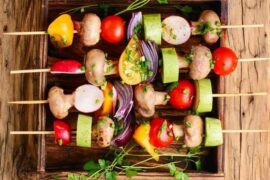 Chilean vegan anticuchos, grilled skewers of artichoke, mushrooms, cherry tomatoes, peppers, onion, and zucchini