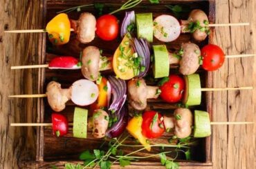 Chilean vegan anticuchos, grilled skewers of artichoke, mushrooms, cherry tomatoes, peppers, onion, and zucchini
